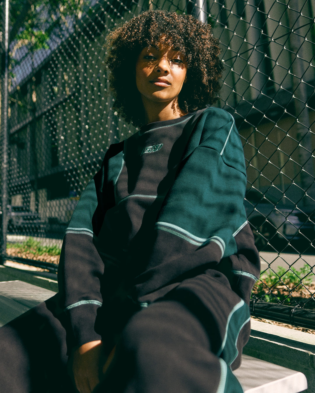 Woman wearing Stitch Up Oversized Fleece Sweater - Black-Dark Moss | Model:Tomi | Size:S - view 2