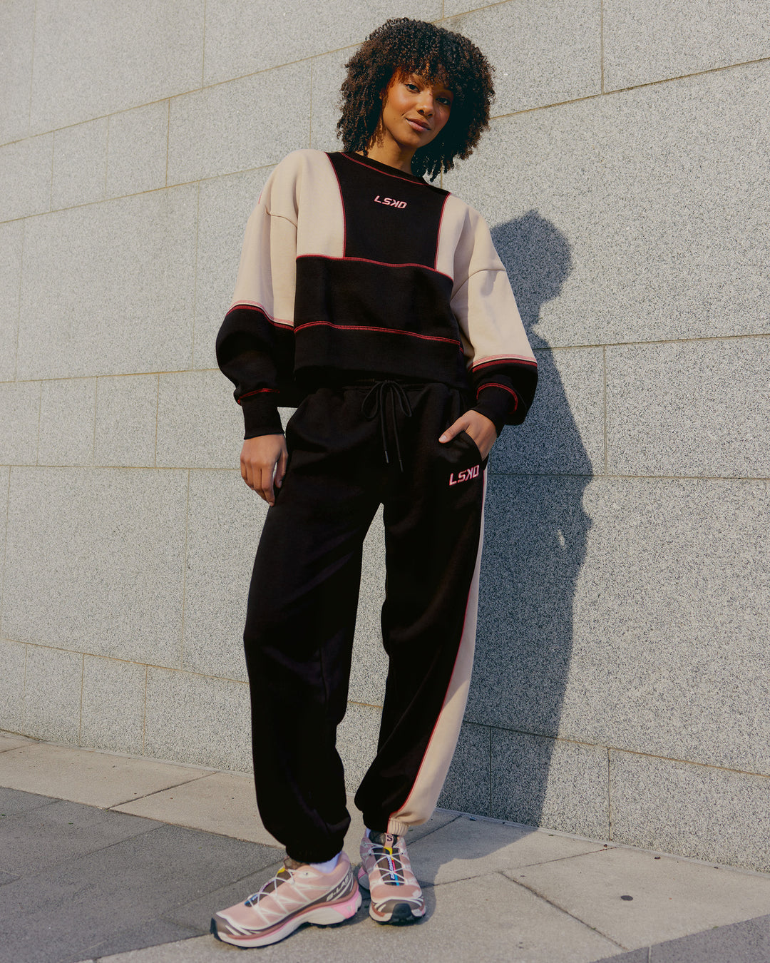 Woman wearing Stitch Up Oversized Fleece Sweater - Black-Shale Beige | Model:Tomi | Size:S - view 4