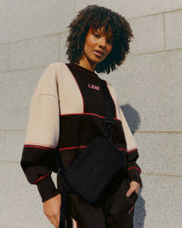 Woman wearing Stitch Up Oversized Fleece Sweater - Black-Shale Beige | Model:Tomi | Size:S | Thumbnail Index: 0