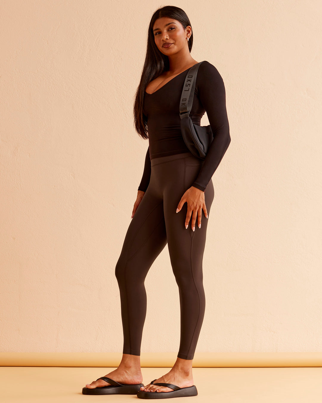 Woman wearing Vitality Long Sleeve Top - Black | Model:Nikki | Size:S - view 4