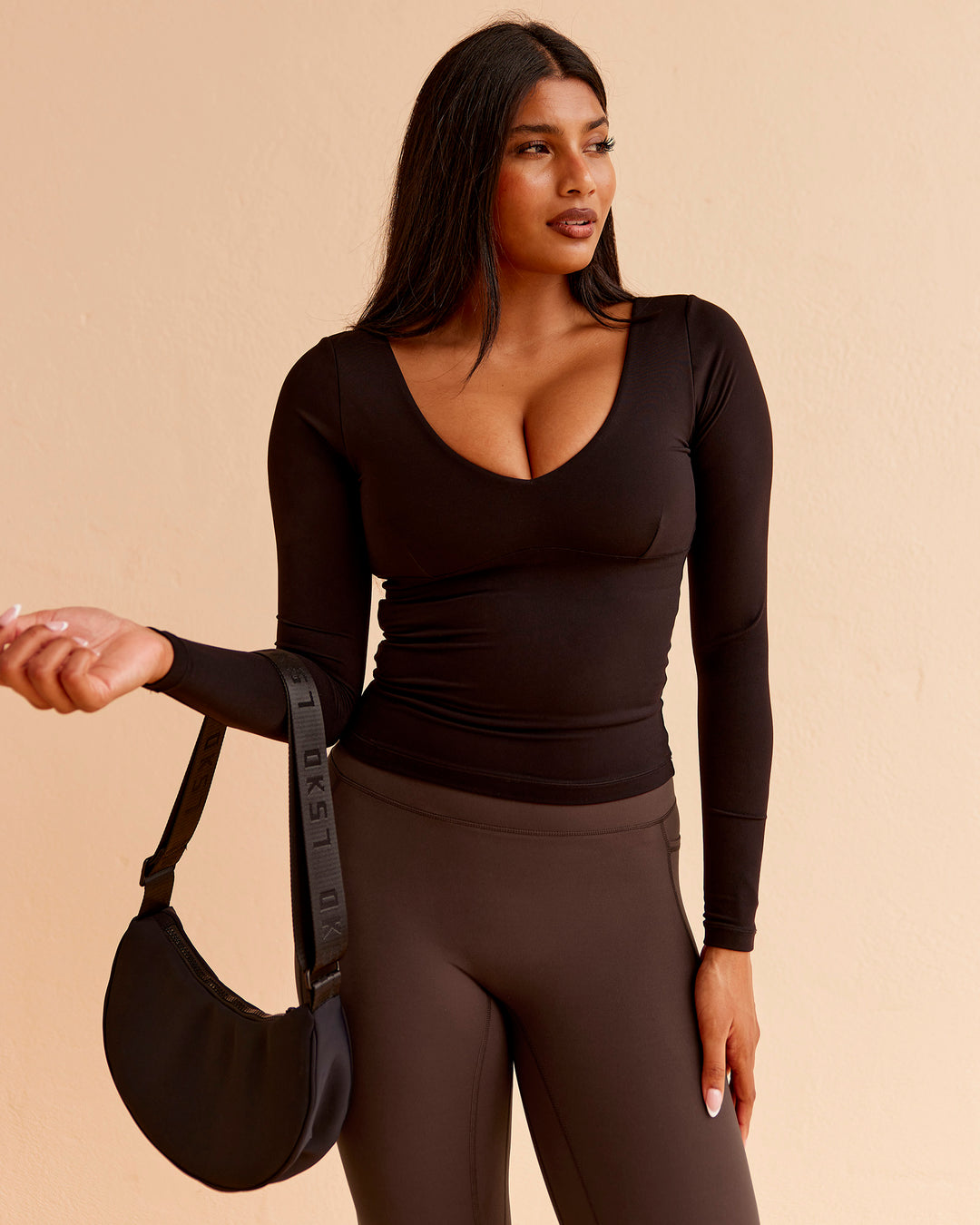 Woman wearing Vitality Long Sleeve Top - Black | Model:Nikki | Size:S - view 3