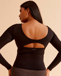Woman wearing Vitality Long Sleeve Top - Black | Model:Nikki | Size:S | Thumbnail Index: 0