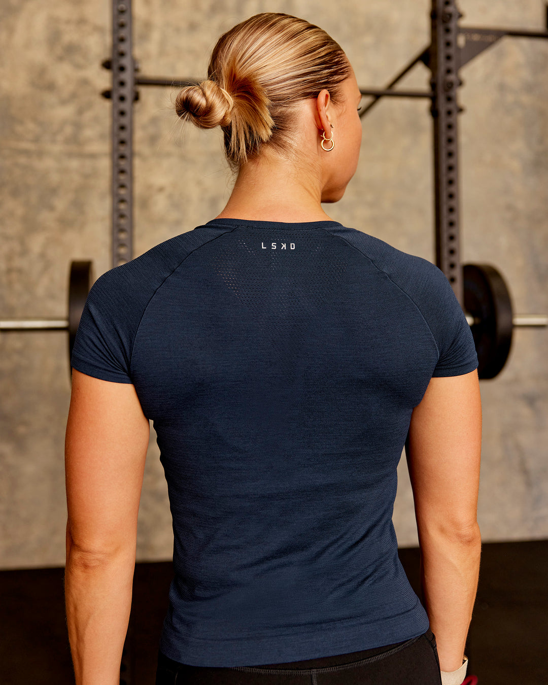 Woman wearing AeroFLX+ Seamless Tee - Future Navy/Future Navy | Model:Gabi | Size:S - view 2