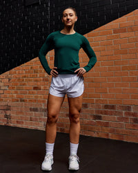 Woman wearing AeroFLX+ Seamless Long Sleeve Tee - Dark Moss/Dark Moss | Model:Summer | Size:S | Thumbnail Index: 3