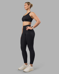 Woman wearing Stability Sports Bra - Black | Model:Amy | Size:S (D-E Cup) | Thumbnail Index: 4
