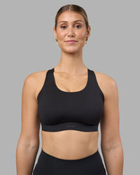 Woman wearing Stability Sports Bra - Black | Model:Amy | Size:S (D-E Cup) | Thumbnail Index: 0