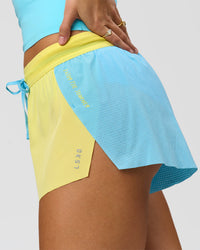 Woman wearing GG Accelerate 3" Mid-Rise Running Short - Baltic Sea-Lemon | Model:Grace | Size:S | Thumbnail Index: 11