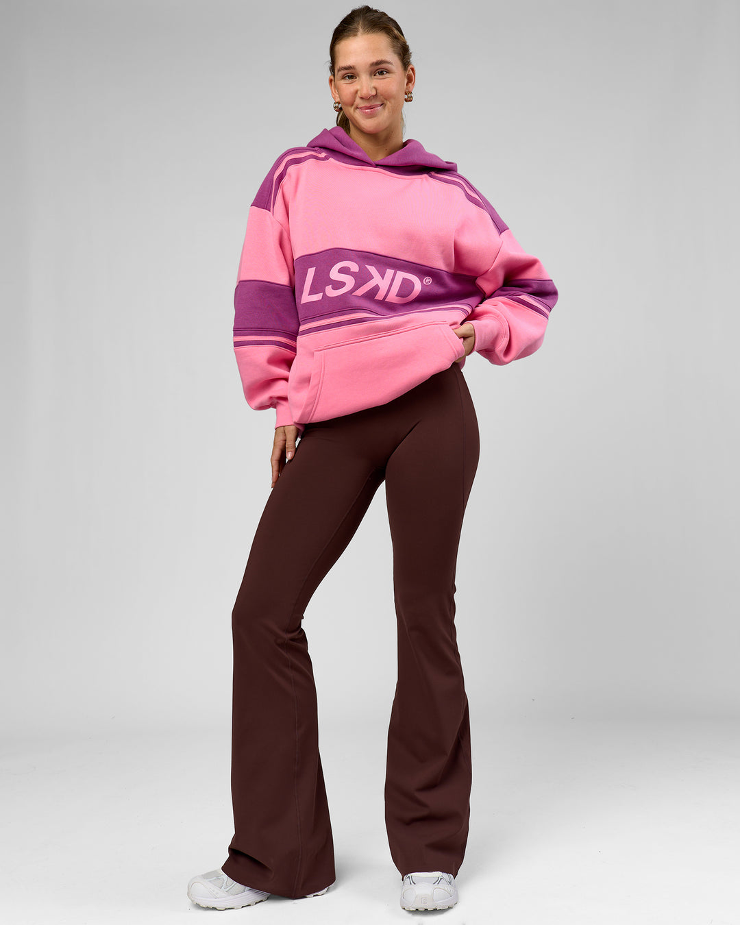 Woman wearing A-Team Oversized Hoodie - Candy Pink-Boysenberry | Model:Amity | Size:S - view 12
