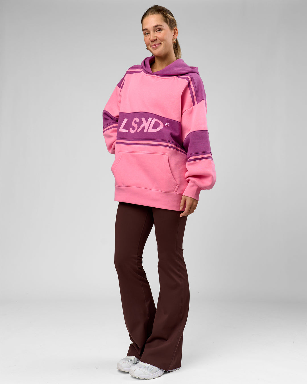 Woman wearing A-Team Oversized Hoodie - Candy Pink-Boysenberry | Model:Amity | Size:S - view 10