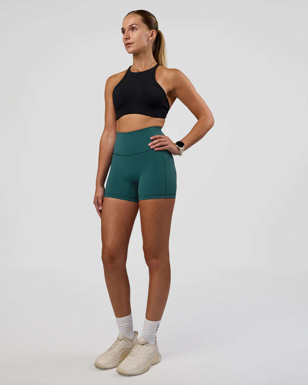 Woman wearing AMRAP High Neck Sports Bra - Black | Model:Myrte | Size:S - view 3