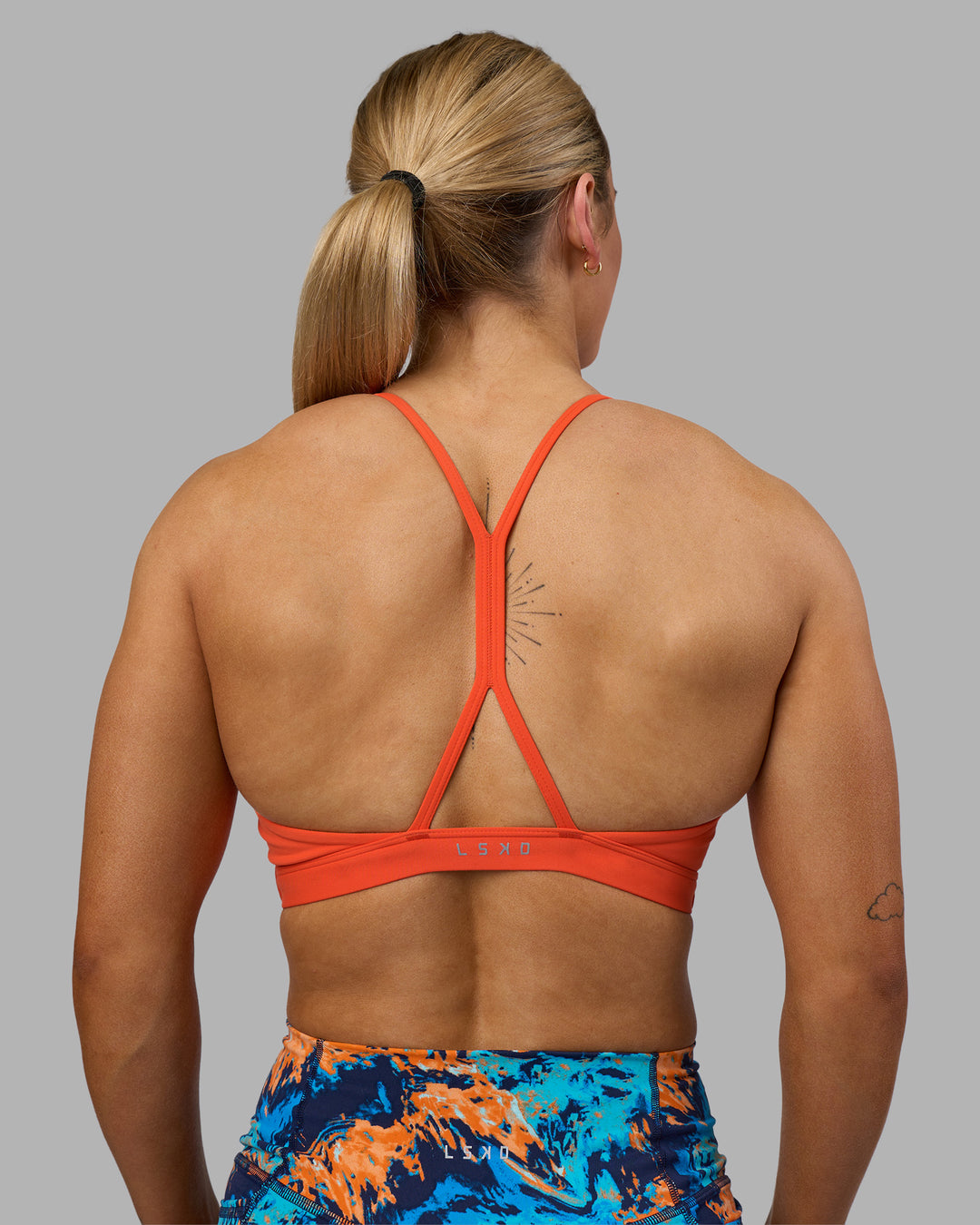 Woman wearing AMRAP High Neck Sports Bra - Ultra Orange | Model:Georgia | Size:S - view 2