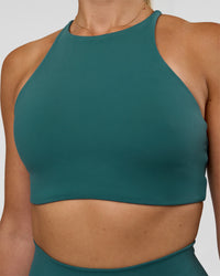 Woman wearing AMRAP High Neck Sports Bra - Transformative Teal | Model:Myrte | Size:S | Thumbnail Index: 3