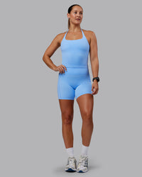 Woman wearing Abs Elixir Ultra High-Rise 6" Short Pockets - Open Air | Thumbnail Index: 0