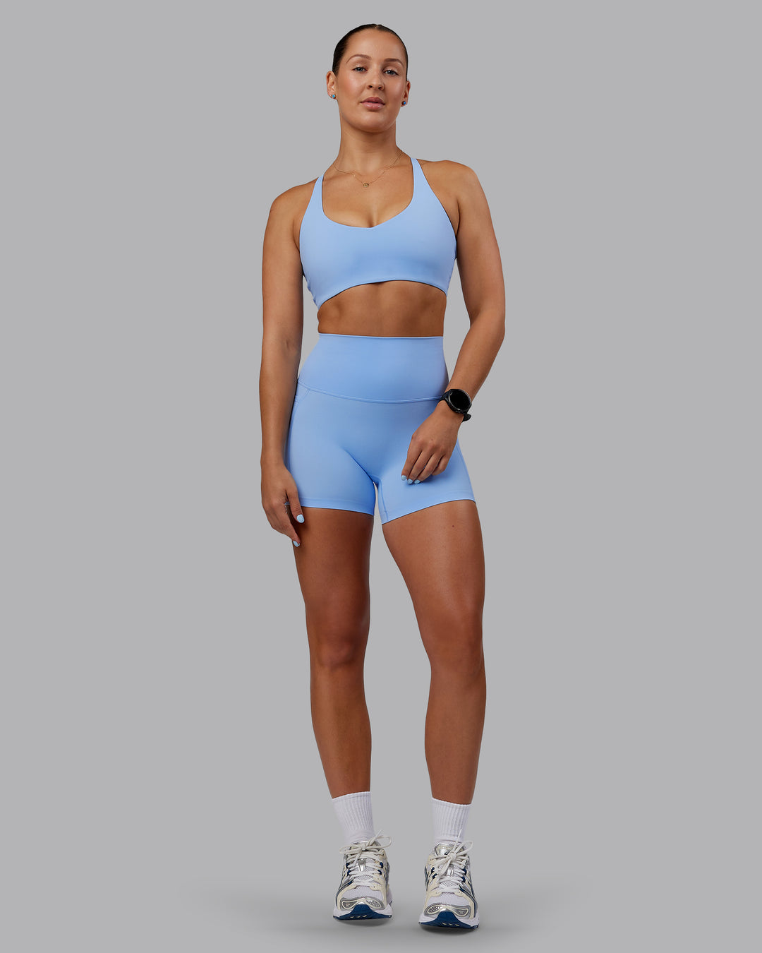 Woman wearing Abs Elixir Ultra High-Rise 4" Short Pockets - Open Air - view 9