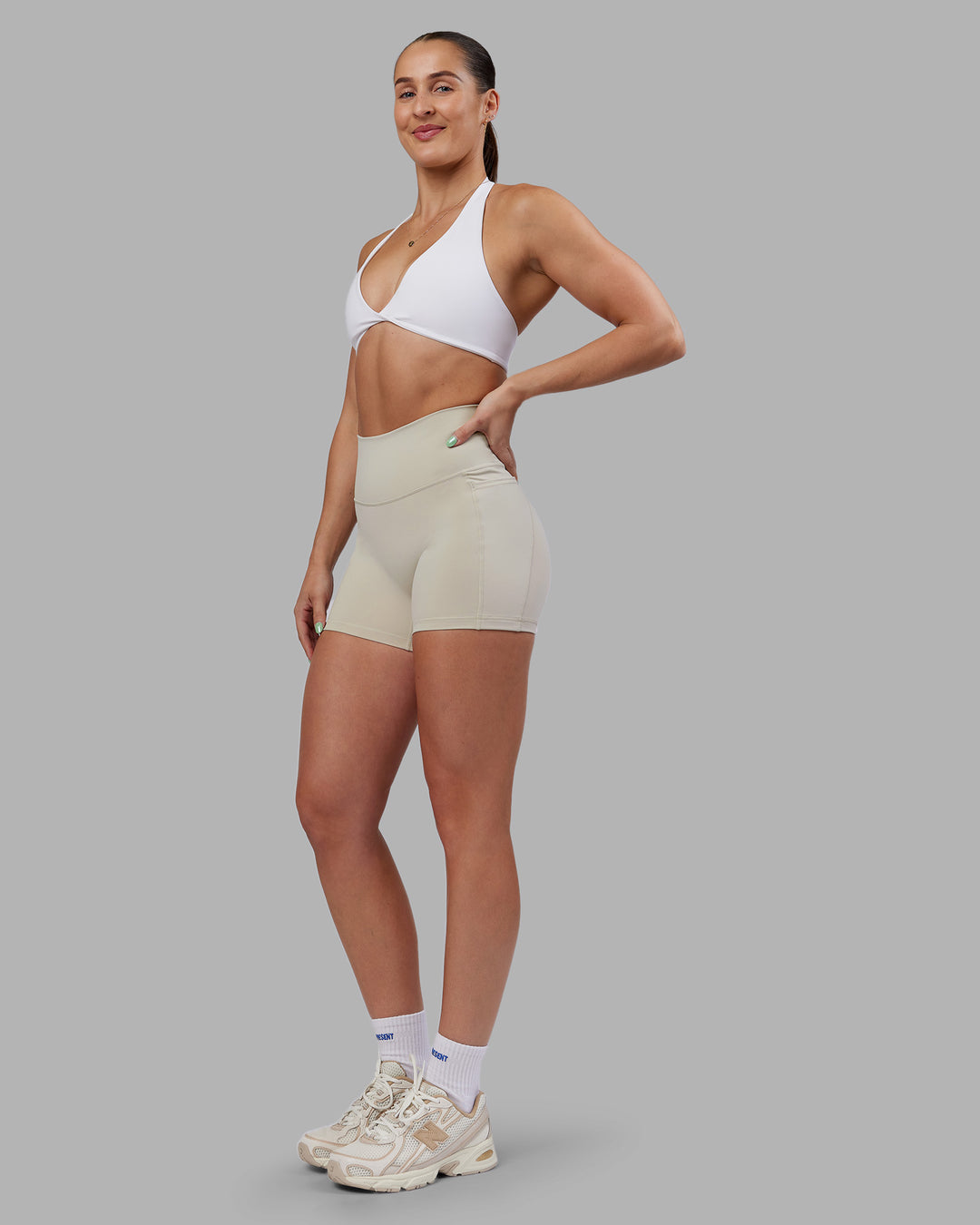 Woman wearing Abs Fusion High-Rise 4" Short Pockets - Shale Beige | Model:Abbey | Size:S - view 9