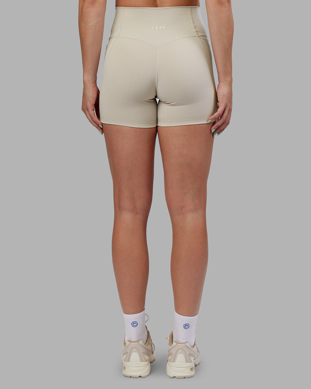 Woman wearing Abs Fusion High-Rise 4" Short Pockets - Shale Beige | Model:Abbey | Size:S - view 5