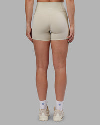 Woman wearing Abs Fusion High-Rise 4" Short Pockets - Shale Beige | Model:Abbey | Size:S | Thumbnail Index: 4