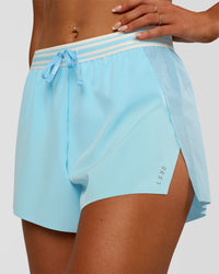 Woman wearing Accelerate 3" High-Rise Running Short - Baltic Sea-Off White | Set:true | Angle:closeup | Model:Emelia | Size:S | Thumbnail Index: 1