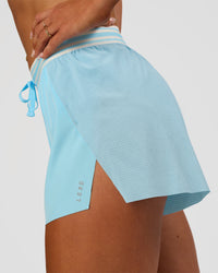 Woman wearing Accelerate 3" High-Rise Running Short - Baltic Sea-Off White | Model:Emelia | Size:S | Thumbnail Index: 4