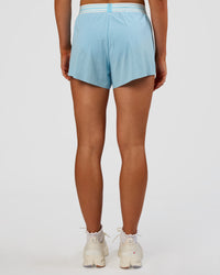 Woman wearing Accelerate 3" High-Rise Running Short - Baltic Sea-Off White | Set:true | Angle:back | Model:Emelia | Size:S | Thumbnail Index: 3