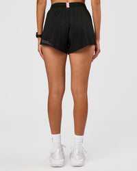 Woman wearing Accelerate 3" High-Rise Running Short - Black-Enjoy The Journey | Model:Rhiley | Size:S | Thumbnail Index: 7