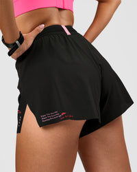 Woman wearing Accelerate 3" High-Rise Running Short - Black-Enjoy The Journey | Model:Rhiley | Size:S | Thumbnail Index: 2
