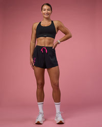Woman wearing Accelerate 3" High-Rise Running Short - Black-Ultra Pink | Model:Hannah | Size:S | Thumbnail Index: 3
