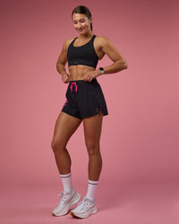 Woman wearing Accelerate 3" High-Rise Running Short - Black-Ultra Pink | Model:Hannah | Size:S | Thumbnail Index: 4