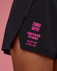 Woman wearing Accelerate 3" High-Rise Running Short - Black-Ultra Pink | Model:Hannah | Size:S | Thumbnail Index: 1