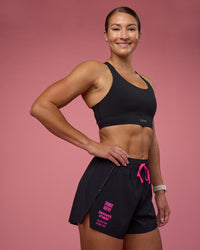 Woman wearing Accelerate 3" High-Rise Running Short - Black-Ultra Pink | Model:Hannah | Size:S | Thumbnail Index: 0