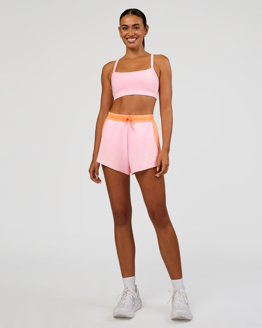 Woman wearing Accelerate 3" High-Rise Running Short - Cantaloupe-Marshmallow | Model:Ruby | Size:S - view 7