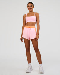 Woman wearing Accelerate 3" High-Rise Running Short - Cantaloupe-Marshmallow | Model:Ruby | Size:S | Thumbnail Index: 6