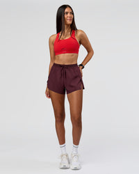 Woman wearing Accelerate 3" High-Rise Running Short - Cherry Lacquer | Model:Rhiley | Size:S | Thumbnail Index: 1