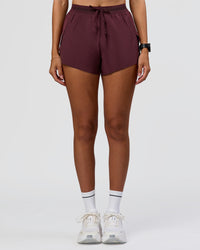 Woman wearing Accelerate 3" High-Rise Running Short - Cherry Lacquer | Model:Rhiley | Size:S | Thumbnail Index: 3