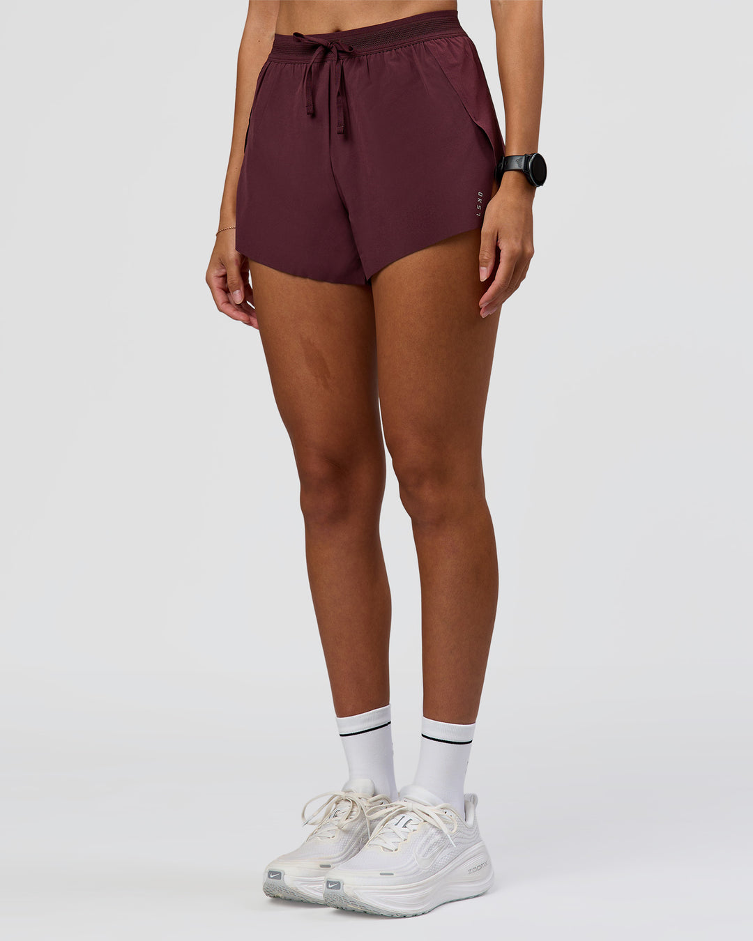 Woman wearing Accelerate 3" High-Rise Running Short - Cherry Lacquer | Model:Rhiley | Size:S - view 6