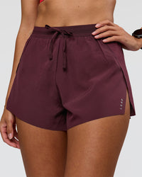 Woman wearing Accelerate 3" High-Rise Running Short - Cherry Lacquer | Model:Rhiley | Size:S | Thumbnail Index: 0