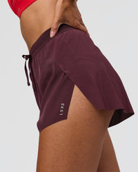Woman wearing Accelerate 3" High-Rise Running Short - Cherry Lacquer | Model:Rhiley | Size:S | Thumbnail Index: 2
