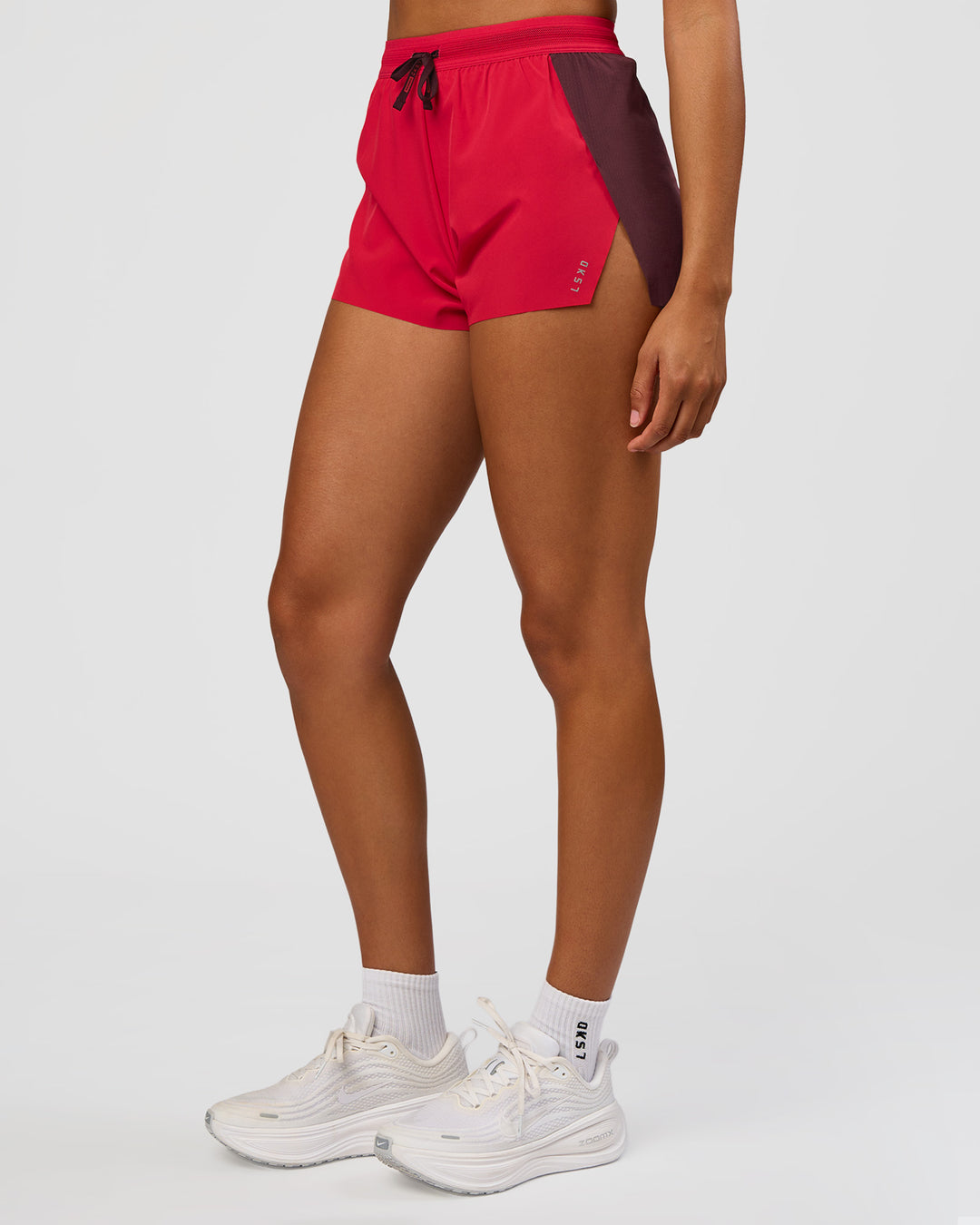 Woman wearing Accelerate 3" High-Rise Running Short - Cherry Lacquer-Scarlet | Model:Rosie | Size:S | - view 6