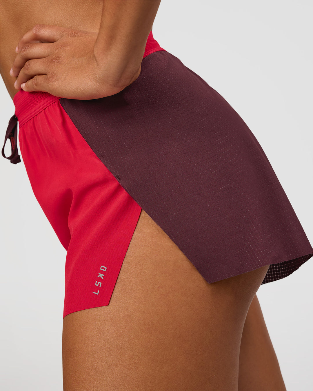 Woman wearing Accelerate 3" High-Rise Running Short - Cherry Lacquer-Scarlet | Model:Rosie | Size:S | - view 3