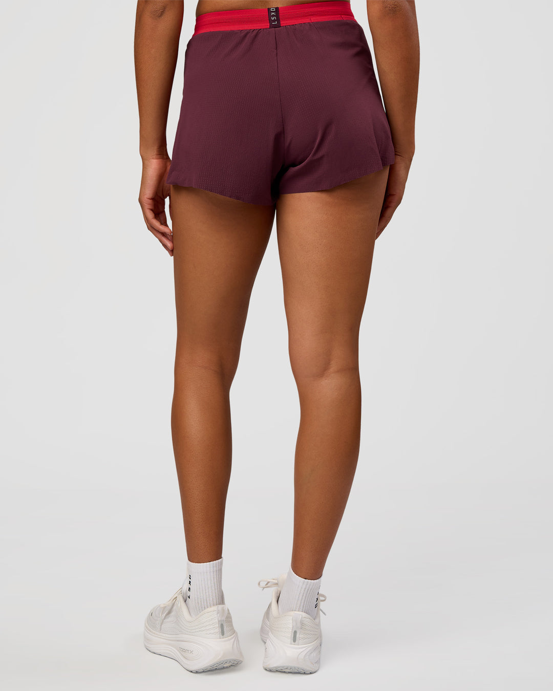 Woman wearing Accelerate 3" High-Rise Running Short - Cherry Lacquer-Scarlet | Model:Rosie | Size:S | - view 2