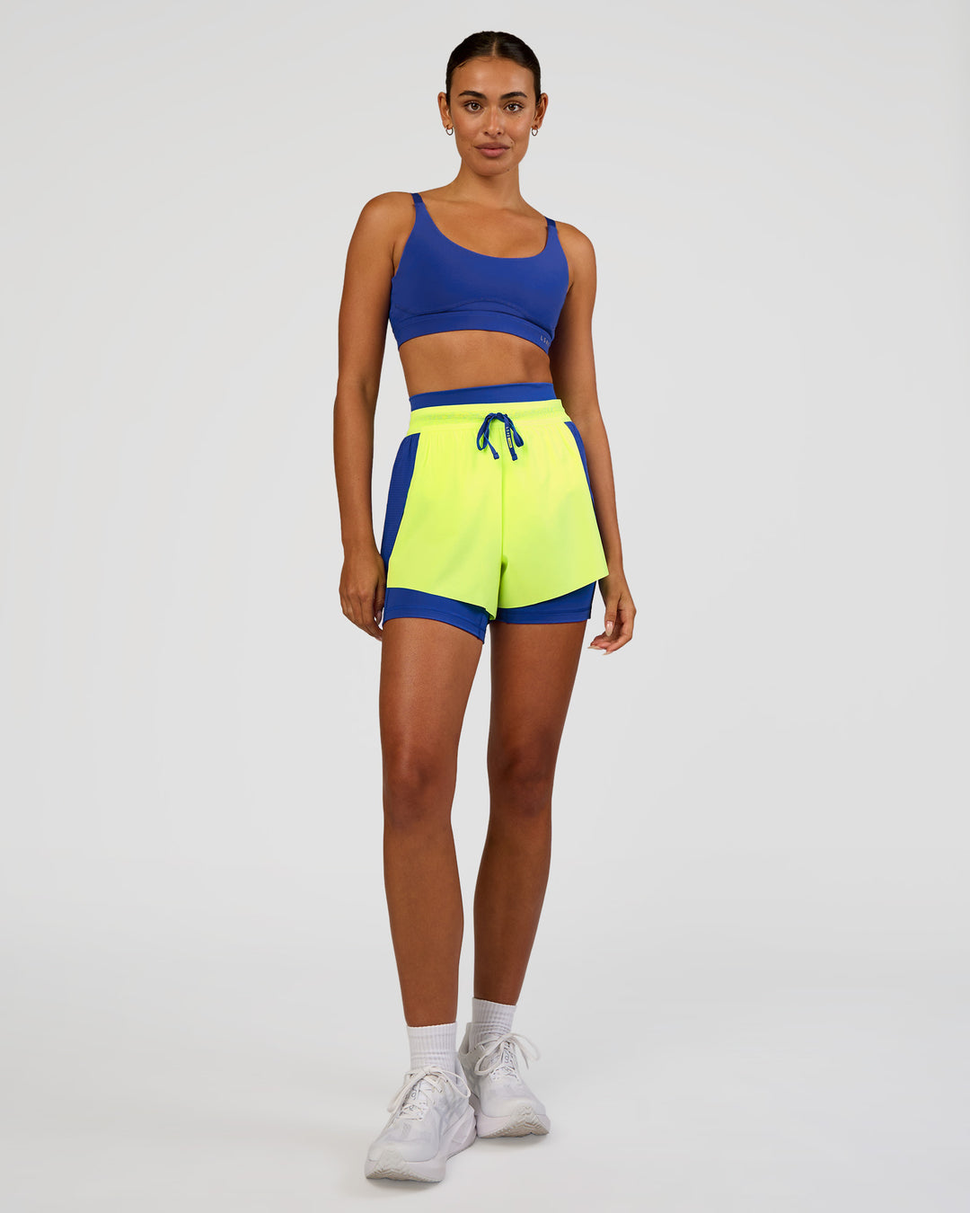 Woman wearing Accelerate 3" High-Rise Running Short - Electric Indigo-Lime Glo | Model:Ruby | Size:S - view 5
