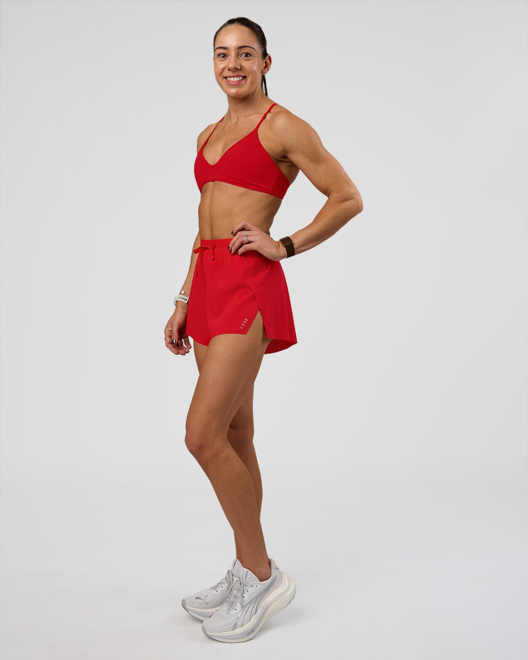 Woman wearing Accelerate 3" High-Rise Running Short - Flame | Model:Zara | Size:S - view 2