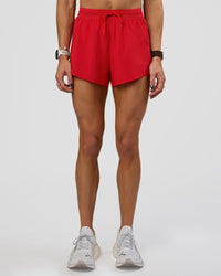 Woman wearing Accelerate 3" High-Rise Running Short - Flame | Set:true | Angle:front | Model:Zara | Size:S | Thumbnail Index: 6