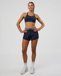 Woman wearing Accelerate 3" High-Rise Running Short - Future Navy-Baltic Sea | Model:Evie | Size:S | Thumbnail Index: 1