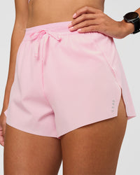 Woman wearing Accelerate 3" High-Rise Running Short - Marshmallow | Set:true | Angle:closeup | Model:Rhiley | Size:S | Thumbnail Index: 1
