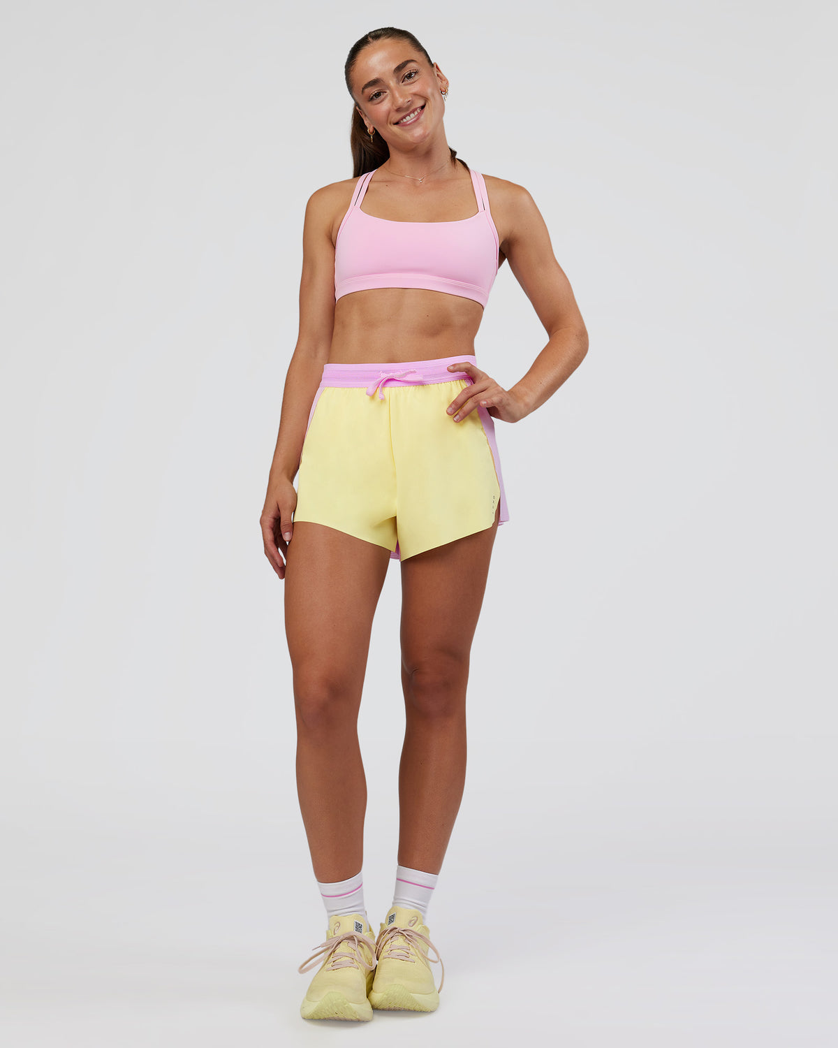 Woman wearing Accelerate 3" High-Rise Running Short - Marshmallow-Lemon | Model:Grace | Size:S
