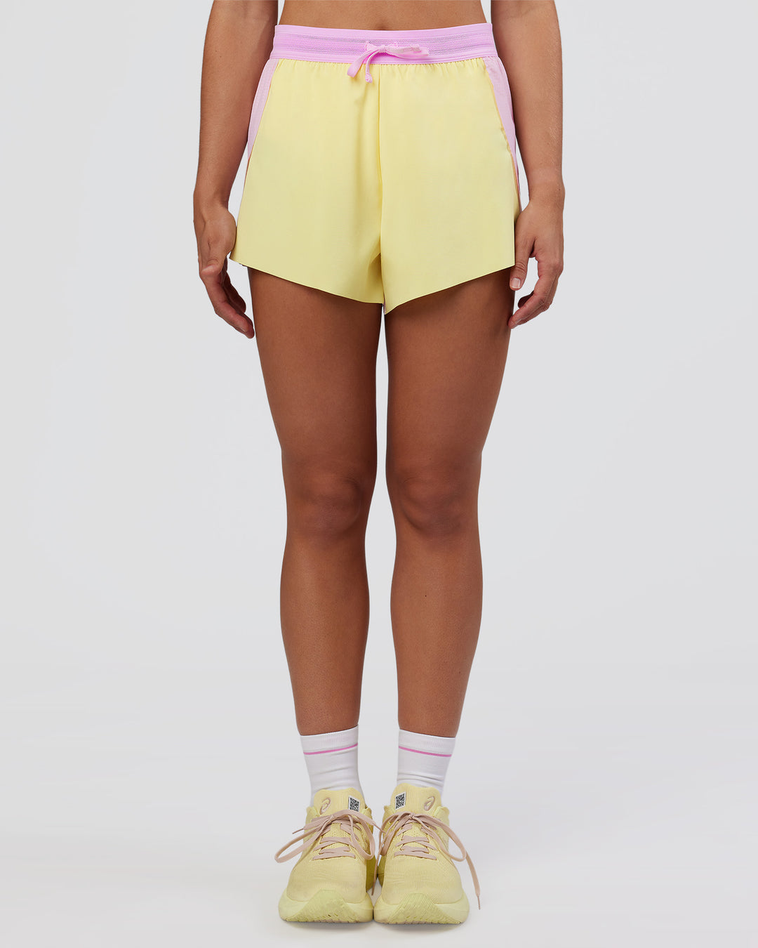 Woman wearing Accelerate 3" High-Rise Running Short - Marshmallow-Lemon | Set:true | Angle:front | Model:Grace | Size:S - view 6