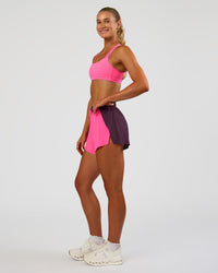 Woman wearing Accelerate 3" High-Rise Running Short - Midnight Plum-Sugar Plum | Model:Emelia | Size:S | Thumbnail Index: 5