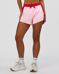 Woman wearing Accelerate 3" High-Rise Running Short - Scarlet-Marshmallow | Set:true | Angle:front | Model:Amity | Size:S | Thumbnail Index: 2