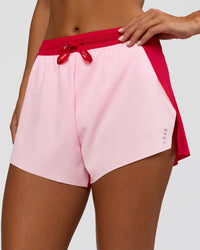 Woman wearing Accelerate 3" High-Rise Running Short - Scarlet-Marshmallow | Set:true | Angle:closeup | Model:Amity | Size:S | Thumbnail Index: 0